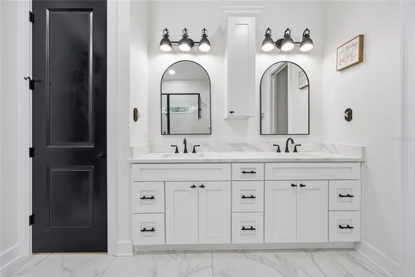 a kitchen with stainless steel appliances granite countertop a refrigerator sink and microwave