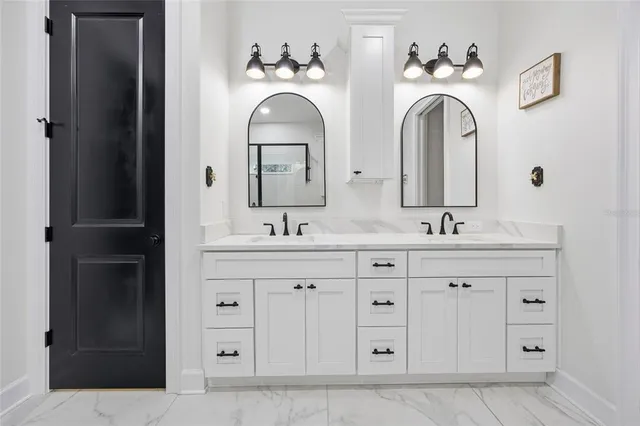 a kitchen with stainless steel appliances granite countertop a refrigerator sink and microwave