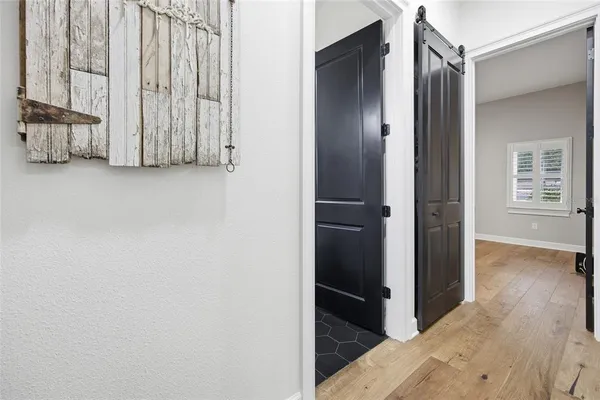 a bathroom with a sink mirror and shower