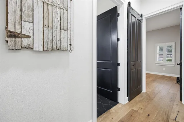 a bathroom with a sink mirror and shower