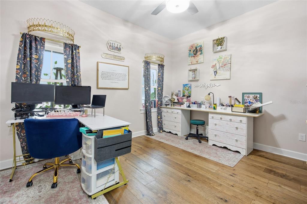 12052 Southeast 101st Court Road Belleview, FL 34420 - Photo 32 of 74 a room with furniture and a wooden floor