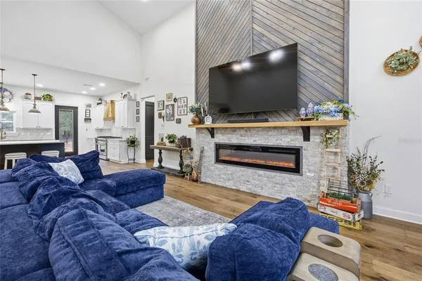 a dining room with furniture and wooden floor