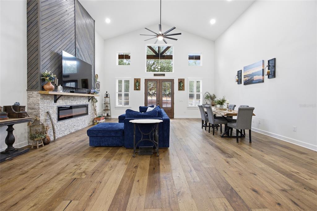 12052 Southeast 101st Court Road Belleview, FL 34420 - Photo 10 of 74 a living room with furniture and a wooden floor