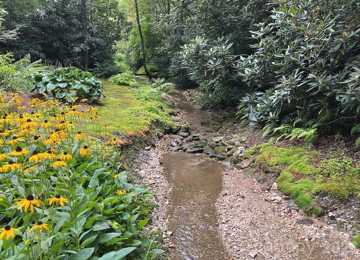 3434 Old Jonas Ridge Road Newland, NC 28657 - Photo 11 of 46 a view of a garden with a tree