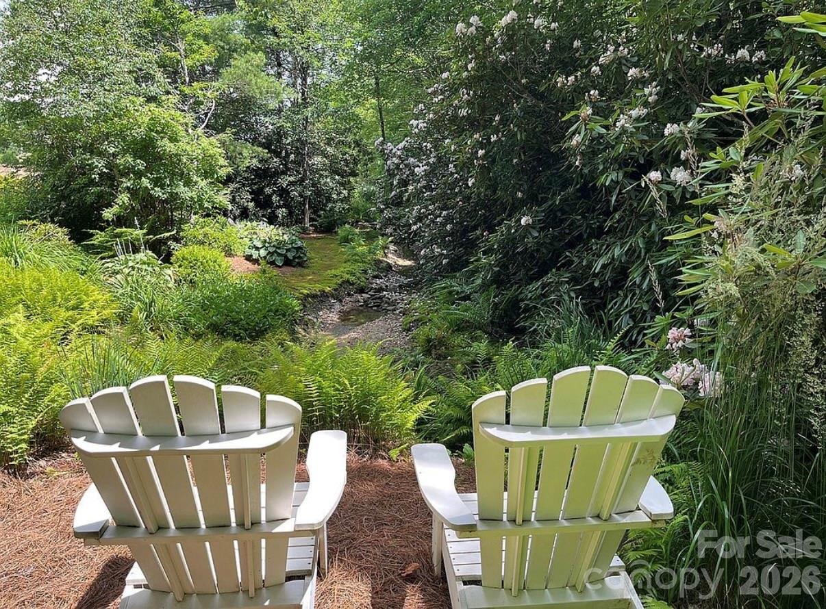 3434 Old Jonas Ridge Road Newland, NC 28657 - Photo 13 of 46 a view of a fountain in a backyard