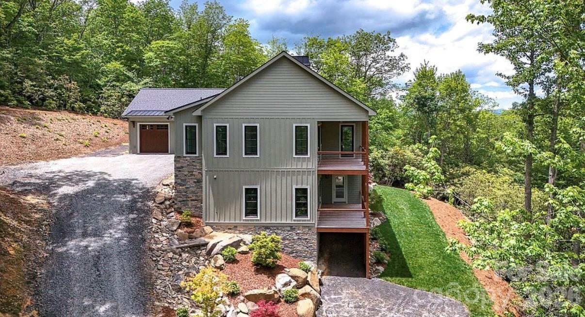 3434 Old Jonas Ridge Road Newland, NC 28657 - Photo 15 of 46 a front view of a house with a yard