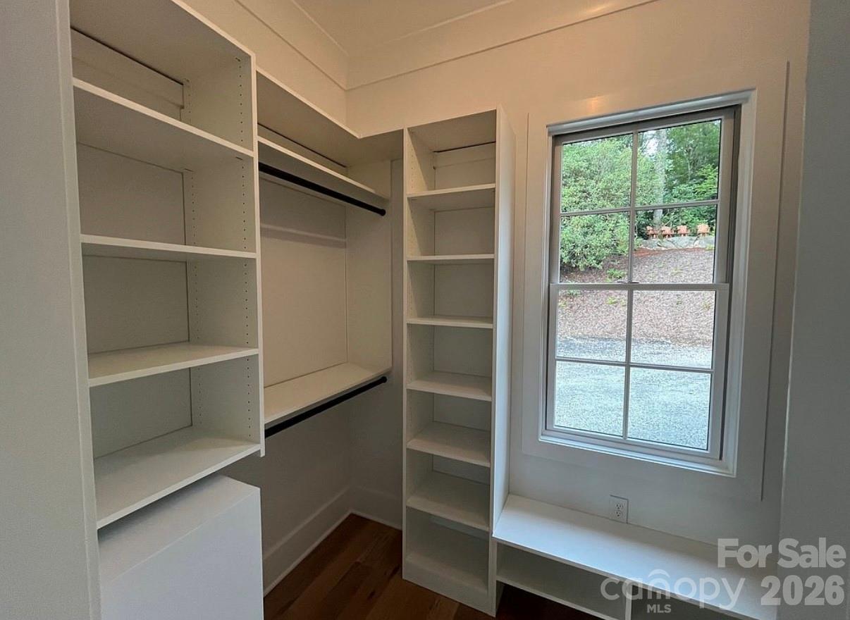 3434 Old Jonas Ridge Road Newland, NC 28657 - Photo 26 of 46 a view of walk in closet with empty racks