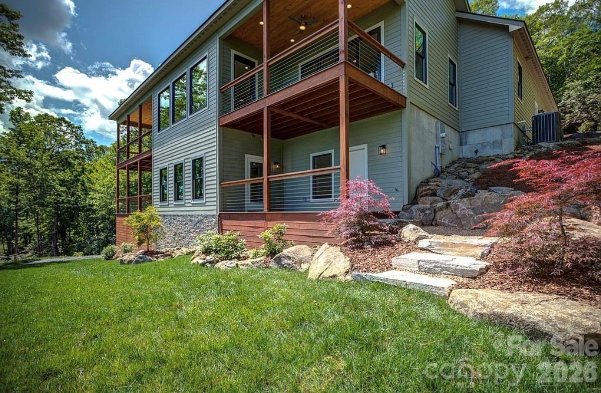 3434 Old Jonas Ridge Road Newland, NC 28657 - Photo 4 of 46 a view of a house with backyard and garden