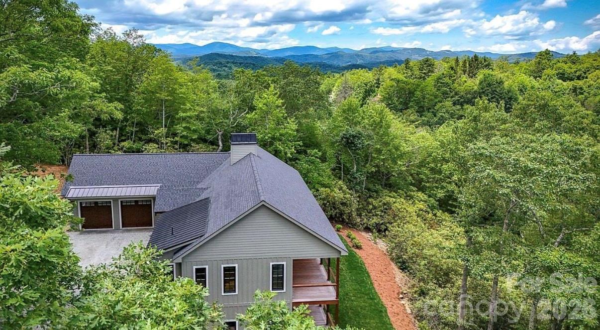 3434 Old Jonas Ridge Road Newland, NC 28657 - Photo 5 of 46 a aerial view of a house next to a yard