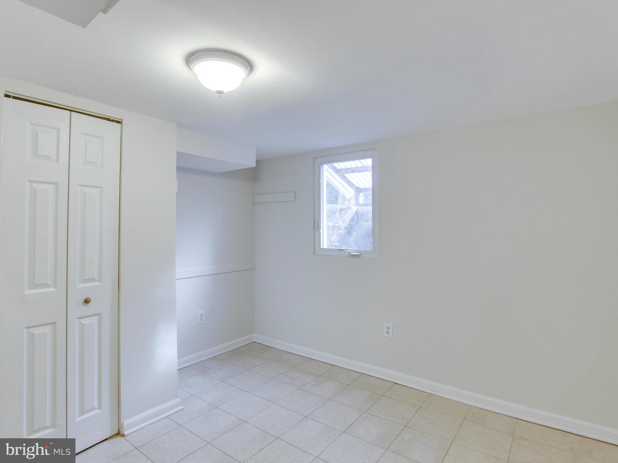 11606 Joseph Mill Road Silver Spring, MD 20906 - Photo 22 of 30 an empty room with a empty space and windows