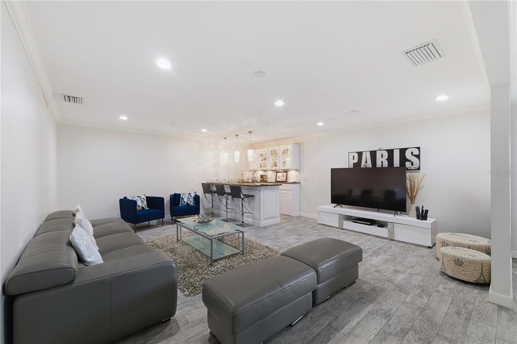 15509 Casey Rd Extension Tampa, FL 33624 - Photo 16 of 65 a living room with furniture and a flat screen tv