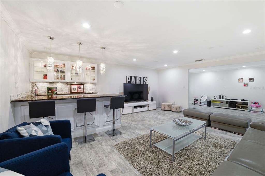 15509 Casey Rd Extension Tampa, FL 33624 - Photo 17 of 65 a living room with furniture and kitchen view