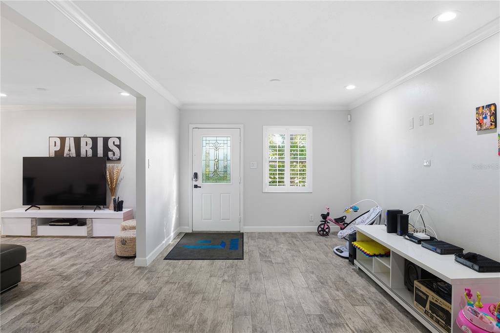15509 Casey Rd Extension Tampa, FL 33624 - Photo 18 of 65 a living room with furniture and a flat screen tv