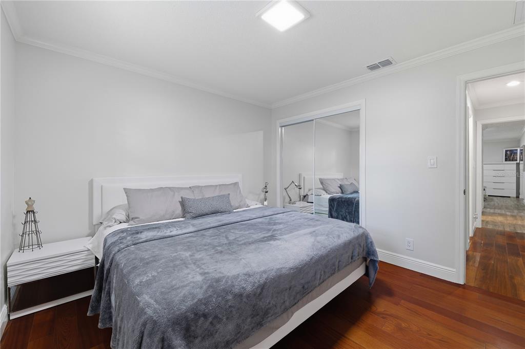 15509 Casey Rd Extension Tampa, FL 33624 - Photo 20 of 65 a bedroom with a bed and a table