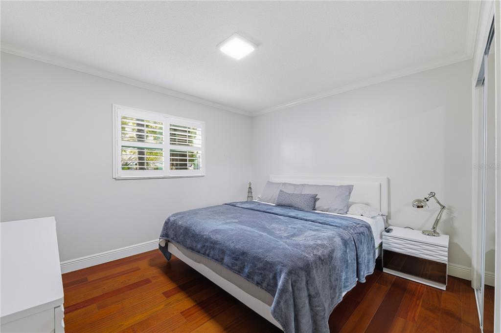 15509 Casey Rd Extension Tampa, FL 33624 - Photo 21 of 65 a bedroom with a bed and a window