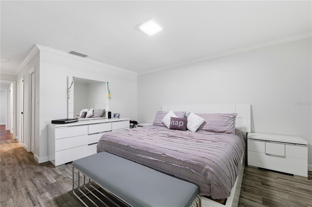 15509 Casey Rd Extension Tampa, FL 33624 - Photo 23 of 65 a bedroom with a bed and a dresser