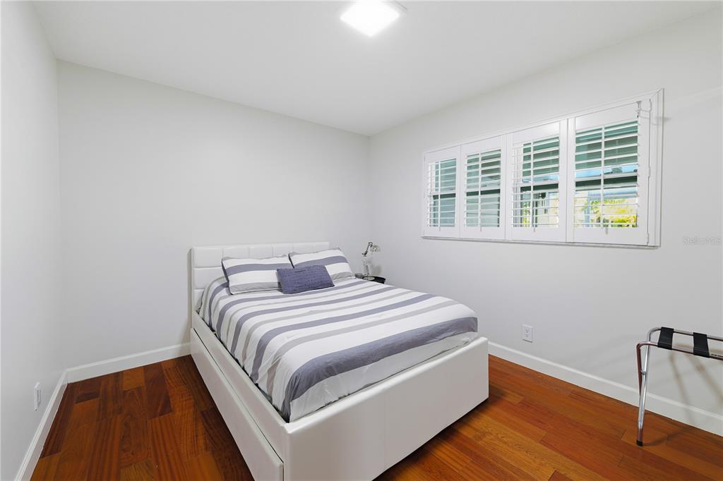 15509 Casey Rd Extension Tampa, FL 33624 - Photo 28 of 65 a bed room with a bed and a chair