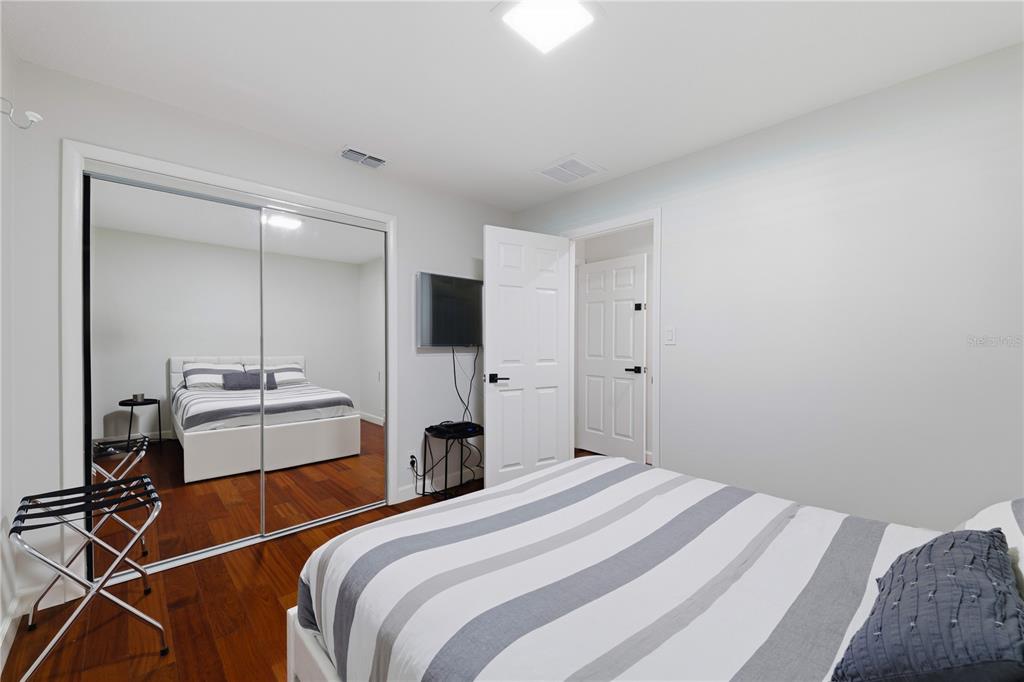 15509 Casey Rd Extension Tampa, FL 33624 - Photo 29 of 65 a bedroom with a bed and a closet