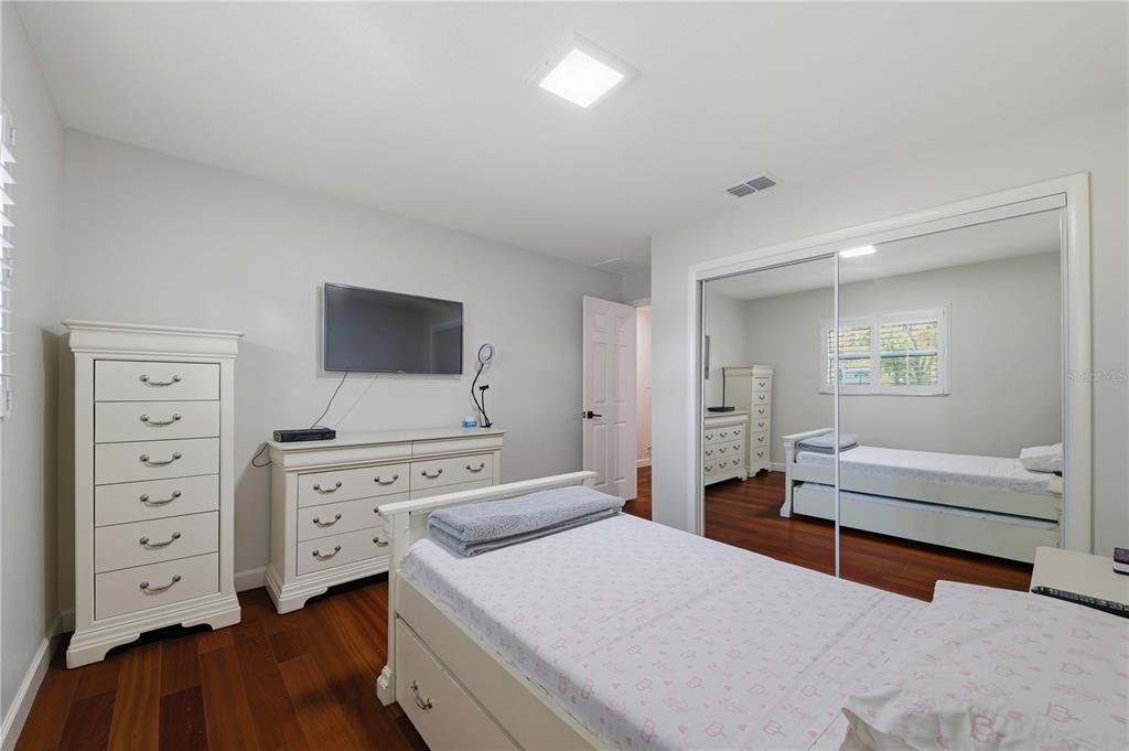 15509 Casey Rd Extension Tampa, FL 33624 - Photo 34 of 65 a bedroom with furniture and window