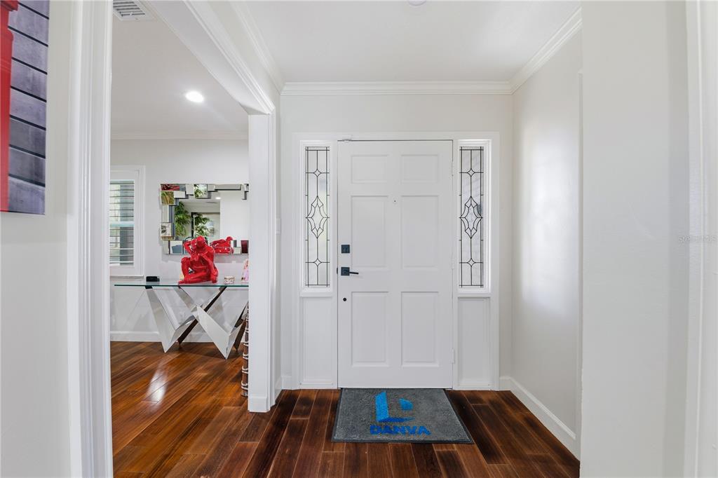 15509 Casey Rd Extension Tampa, FL 33624 - Photo 4 of 65 a view of entryway with wooden floor