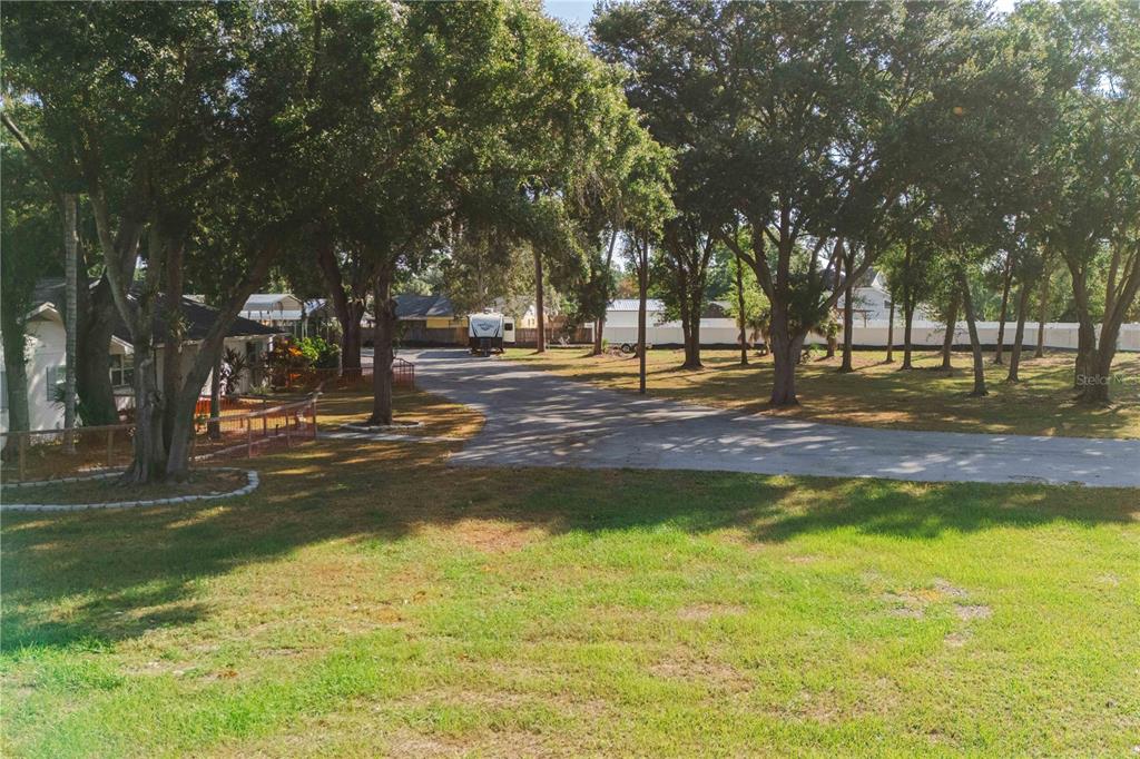 15509 Casey Rd Extension Tampa, FL 33624 - Photo 49 of 65 a backyard of a house with swimming pool and outdoor seating