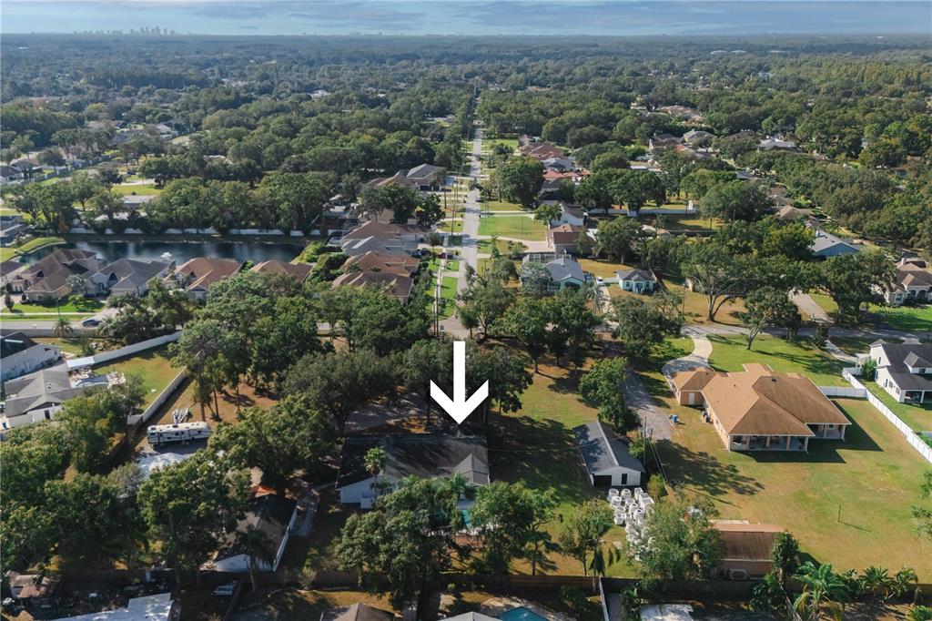 15509 Casey Rd Extension Tampa, FL 33624 - Photo 58 of 65 an aerial view of residential house with parking and trees