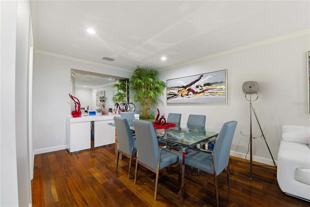 15509 Casey Rd Extension Tampa, FL 33624 - Photo 7 of 65 a view of a dining room with furniture and wooden floor