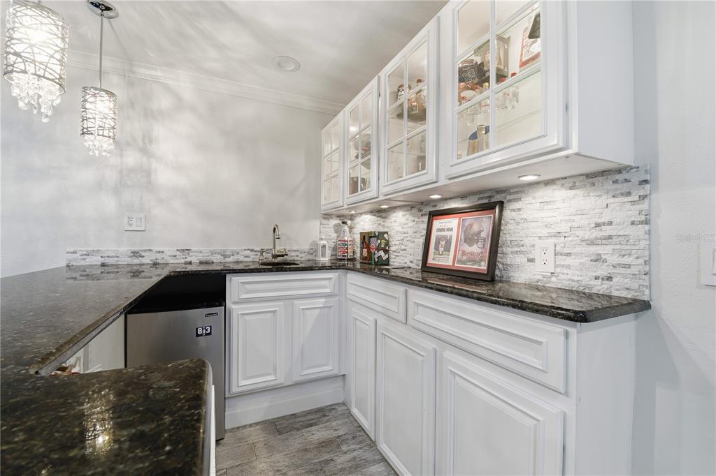 15509 Casey Rd Extension Tampa, FL 33624 - Photo 9 of 65 a kitchen with stainless steel appliances granite countertop a sink and cabinets
