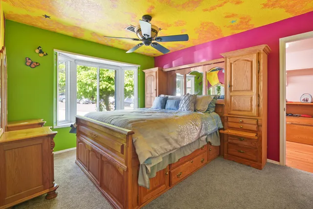 a bed room with a bed and a window