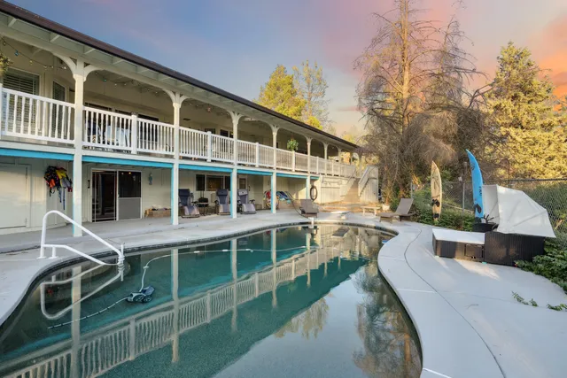 a balcony with table and chairs