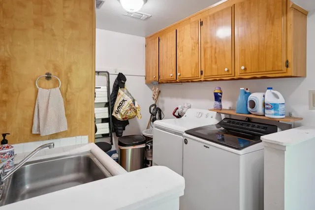 a kitchen that has a sink and a stove