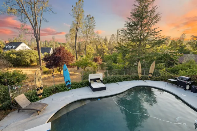 a view of a swimming pool with a patio