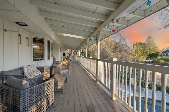 a view of balcony with furniture