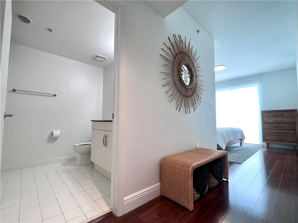 7275 Southwest 90th Way, Unit 504 Miami, FL 33156 - Photo 12 of 24 a living room with furniture and a wooden floor