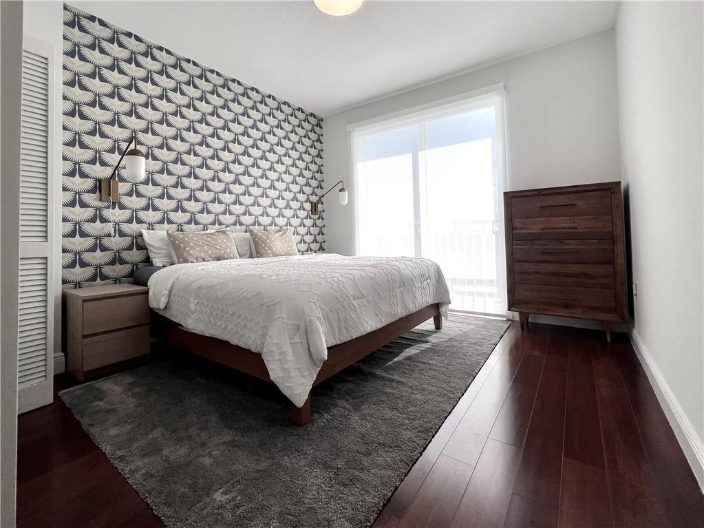 7275 Southwest 90th Way, Unit 504 Miami, FL 33156 - Photo 14 of 24 a bedroom with a bed and a dresser