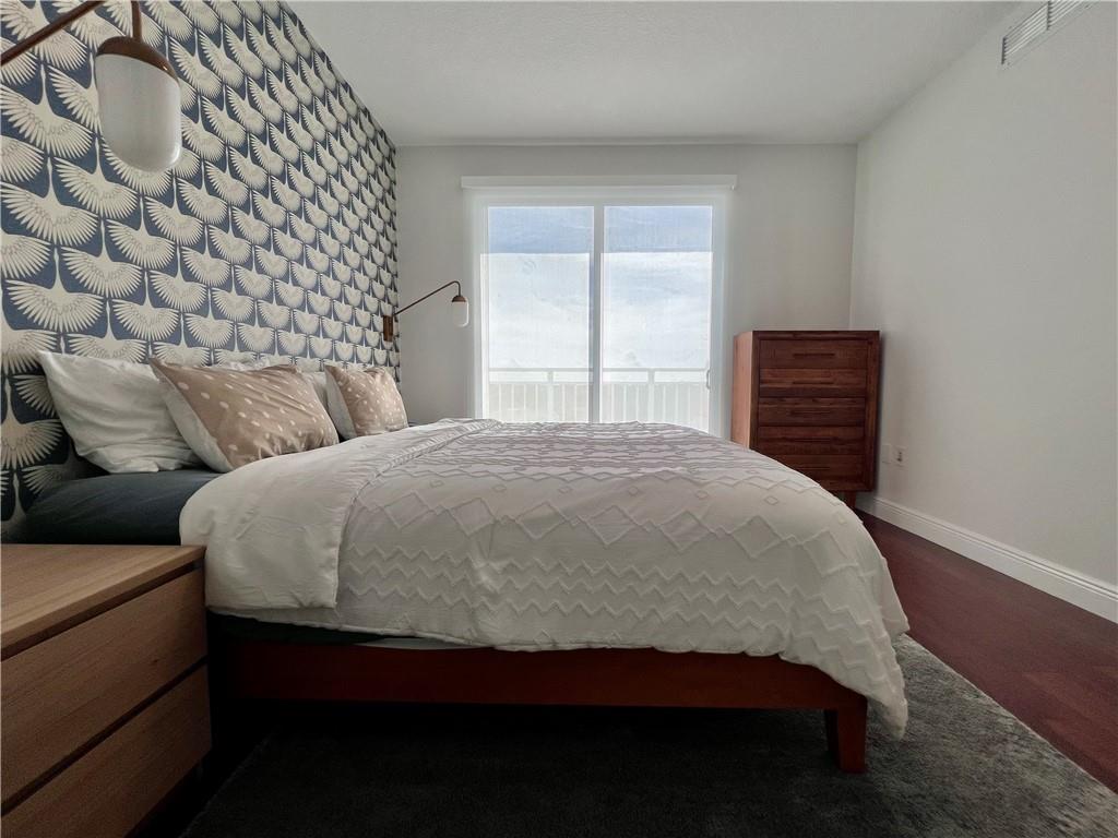 7275 Southwest 90th Way, Unit 504 Miami, FL 33156 - Photo 15 of 24 a bedroom with a bed and a window