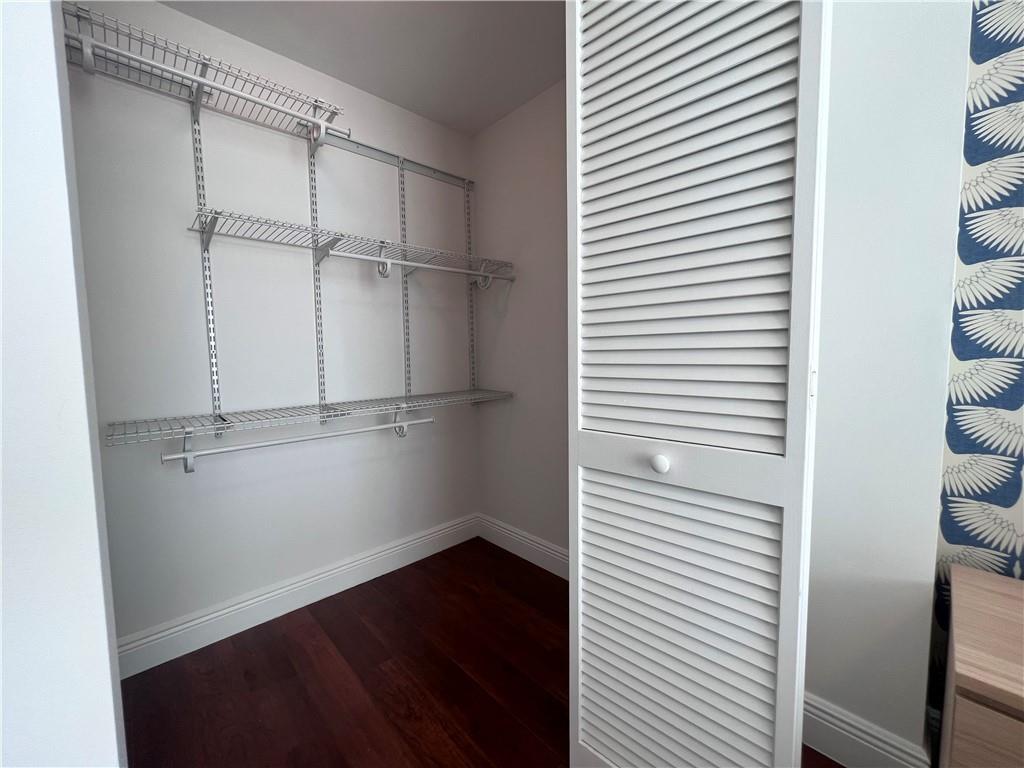 7275 Southwest 90th Way, Unit 504 Miami, FL 33156 - Photo 16 of 24 a view of an empty walk in closet