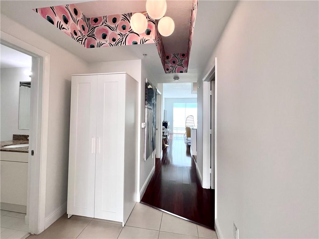 7275 Southwest 90th Way, Unit 504 Miami, FL 33156 - Photo 4 of 24 a view of a hallway with a hallway and stairs