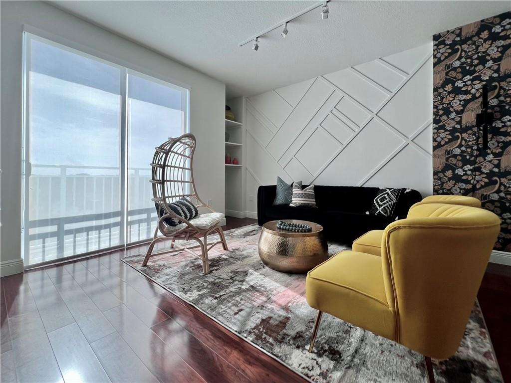 7275 Southwest 90th Way, Unit 504 Miami, FL 33156 - Photo 9 of 24 a living room with furniture a window and a potted plant