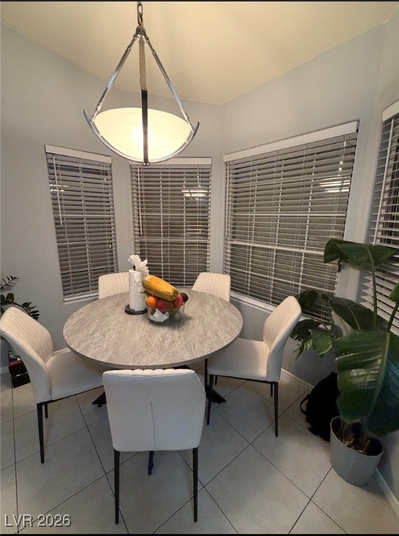 881 Brass Ring Road Las Vegas, NV 89123 - Photo 5 of 13 Dining room featuring light tile patterned flooring and baseboards