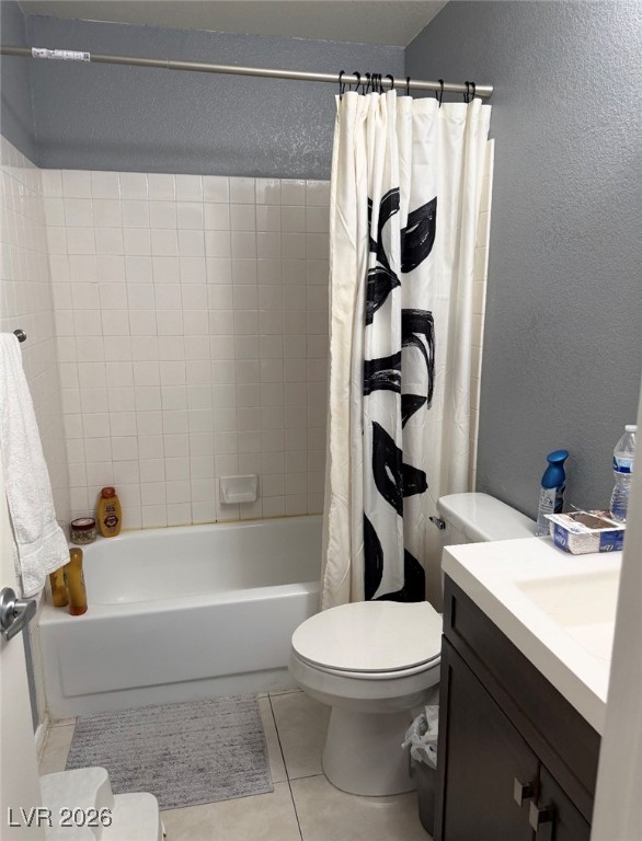 881 Brass Ring Road Las Vegas, NV 89123 - Photo 7 of 13 Bathroom with a textured wall, light tile patterned floors, vanity, and shower / tub combo