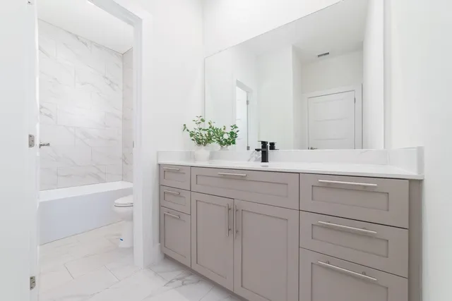 a bathroom with a sink and a bathtub