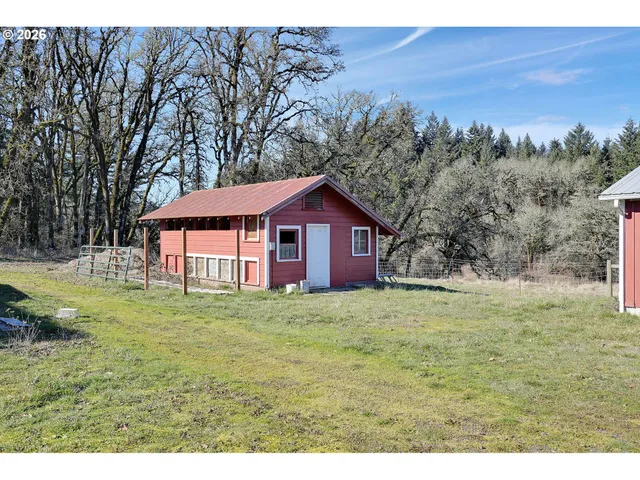 a house with huge green field in front of it