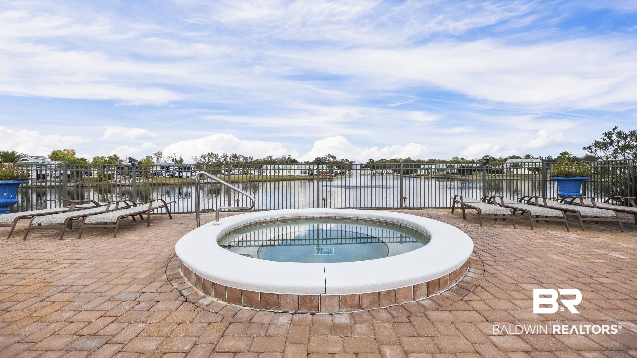 12004 Raptor Court Elberta, AL 36530 - Photo 33 of 57 View of pool with a community hot tub, a patio, and a water view