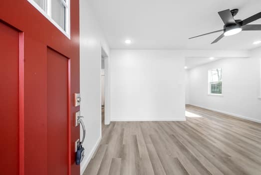 224 Burch Road Clarksville, TN 37042 - Photo 5 of 27 a view of a hallway with wooden floor and a chandelier