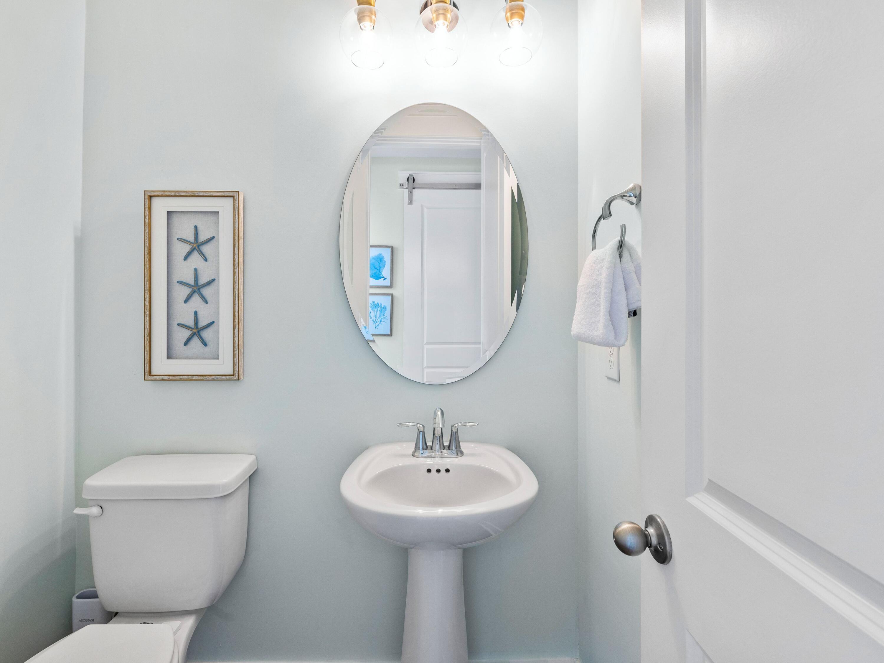 30 Serene Way Santa Rosa Beach, FL 32459 - Photo 18 of 34 a bathroom with a toilet sink and mirror