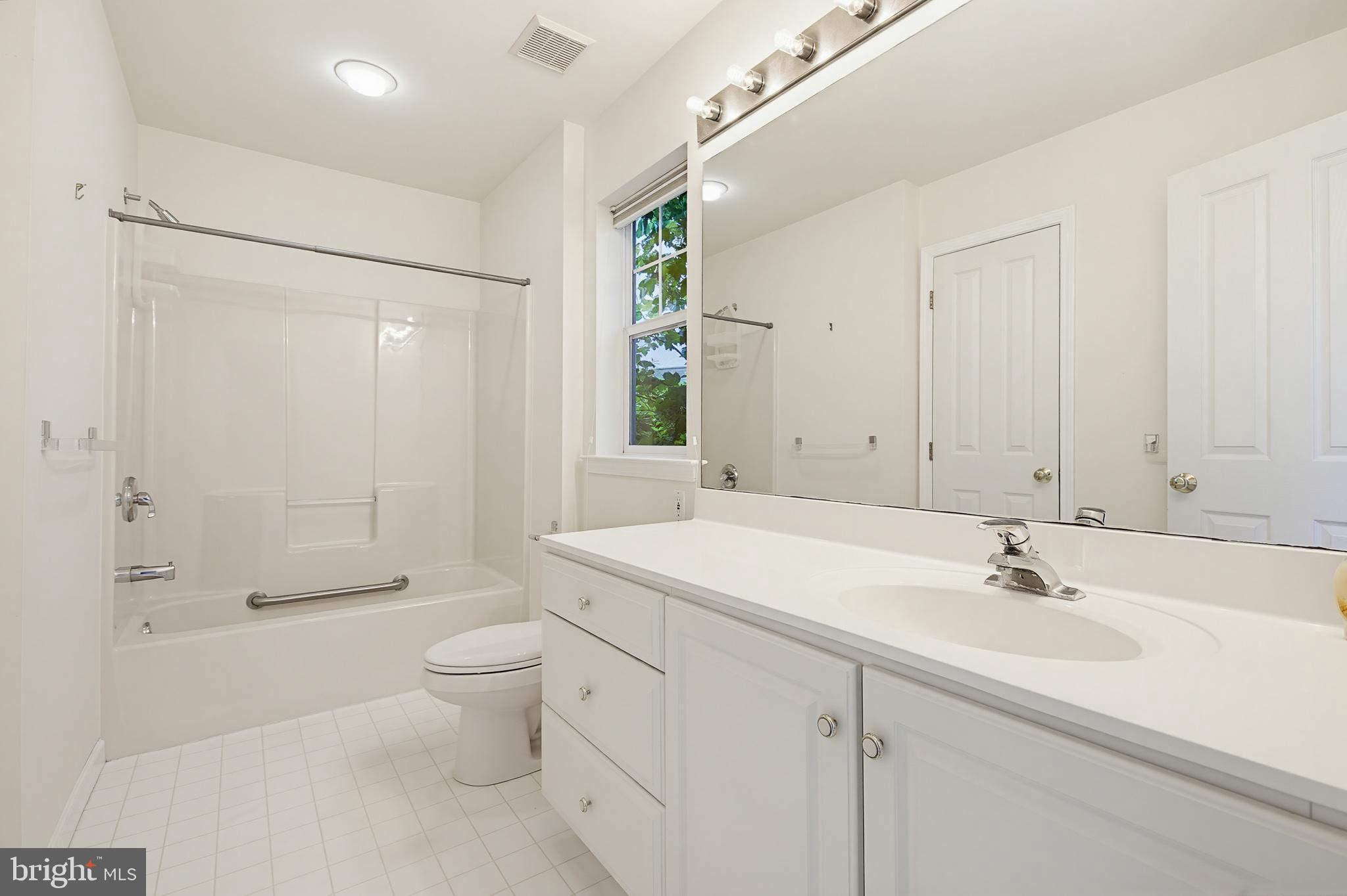 1037 Kent Garden Lititz, PA 17543 - Photo 27 of 31 a bathroom with a sink a toilet and shower