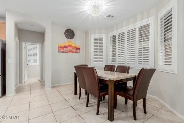 a kitchen with stainless steel appliances granite countertop a sink dishwasher stove top oven and cabinets