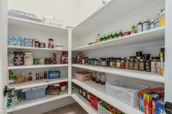 a spacious bedroom with a bed and a window