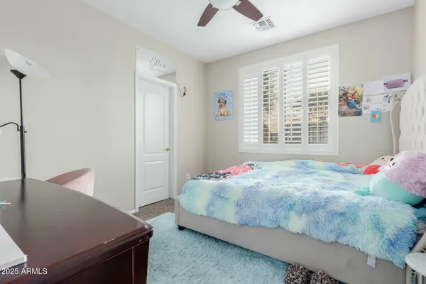 a spacious bathroom with a shower sink vanity mirror and toilet